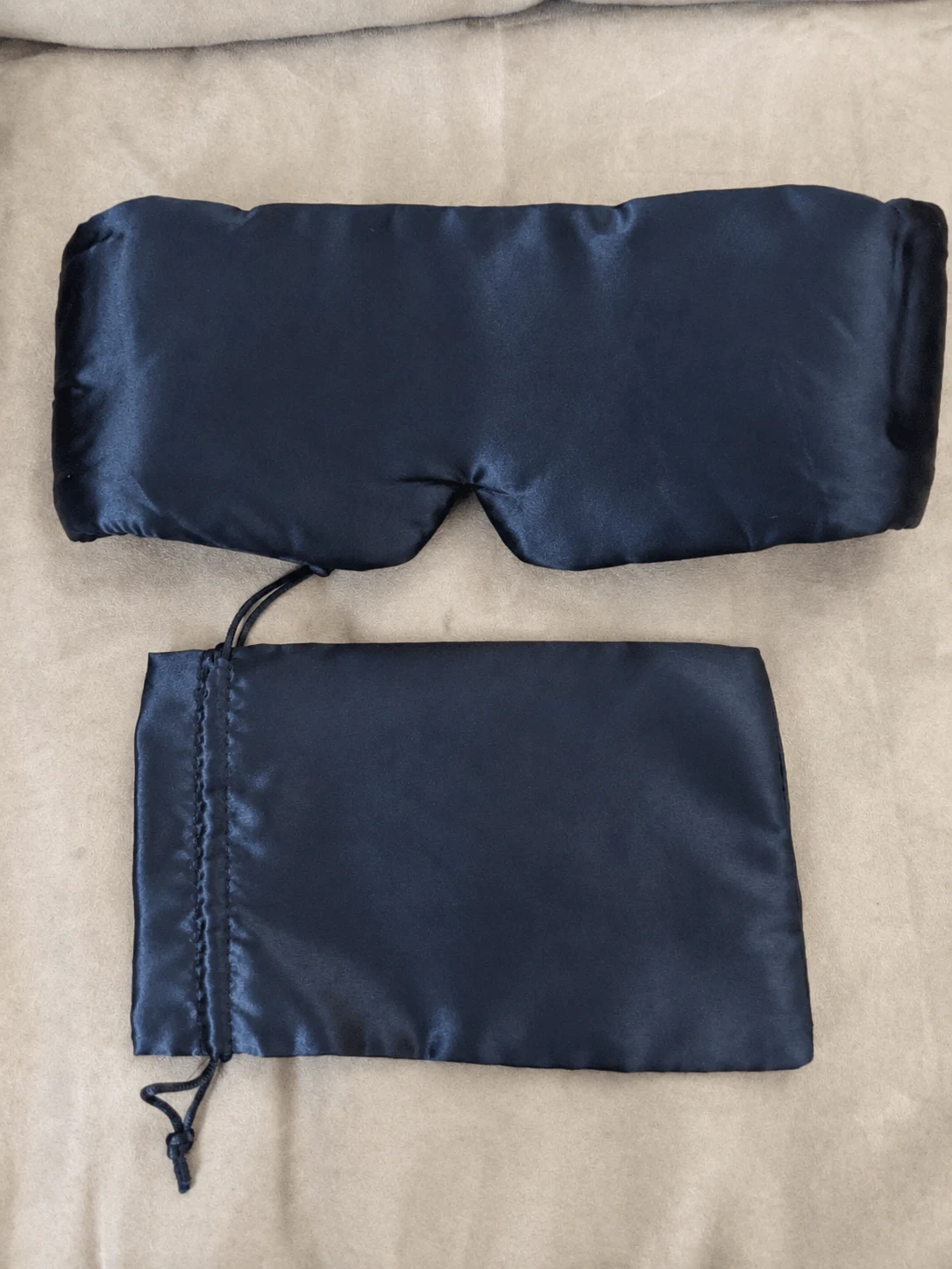 Generated flat-lay photo of a navy mask and matching pouch