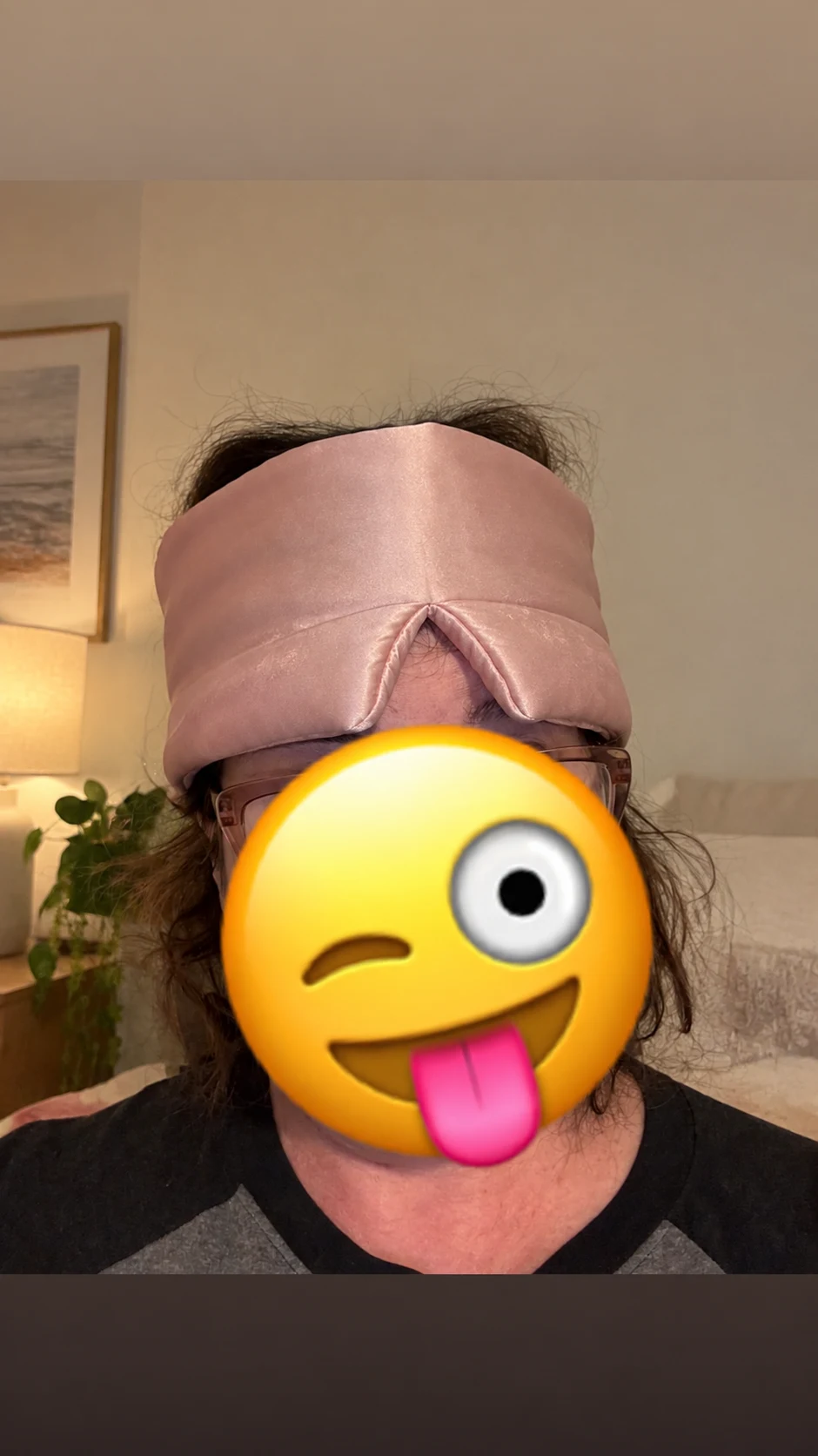 Generated bedroom selfie with a pink mask worn on the forehead and an emoji covering the face