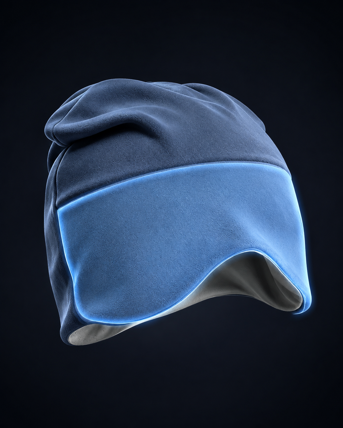 Product illustration of the blue sleep mask in three-quarter view, with the front weighted eye panel highlighted in soft blue and the smooth grey lining visible