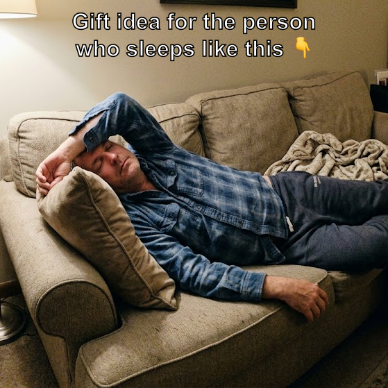Dad sleeping on the sofa with his arm over his forehead